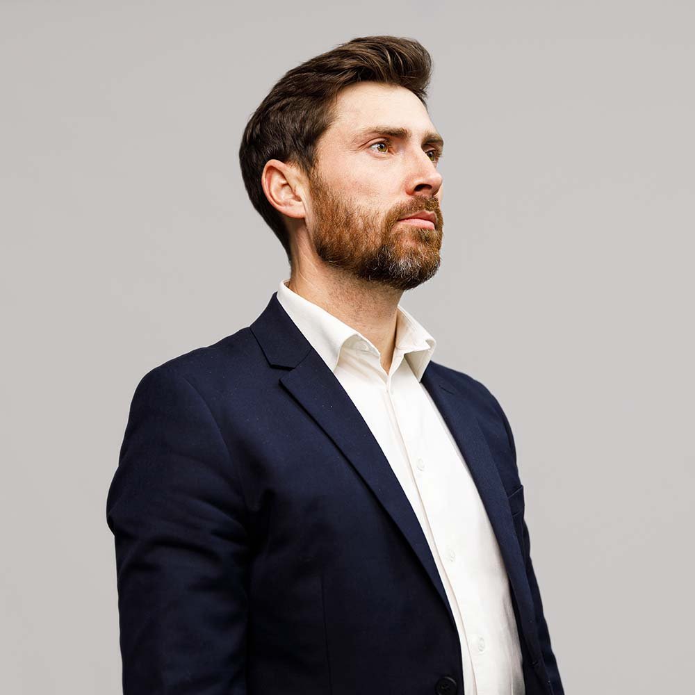 portrait of handsome serious businessman in suit l 7ne2ymk.jpg